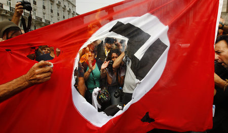 Gegen den deutschen Imperialismus: Proteste beim Staatsbesuch An...