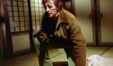 Harry Kilmer (Robert Mitchum) steht für den nächsten Mafiaangrif...
