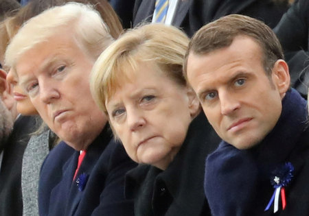 Donald Trump, Angela Merkel und Emmanuel Macron am Sonntag bei d...