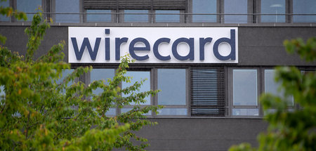 Noch hängt das Schild: Firmensitz von Wirecard im bayerischen As...