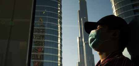 Pendler in Dubai Ende April. Krise trifft Arbeitsmigranten beson...