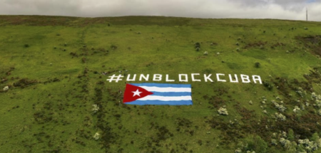 From an Irish mountain, a giant Cuban flag flies with a clear me
