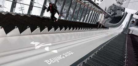 Olympischer Zauber ade? Journalist auf der Treppe des nationalen...