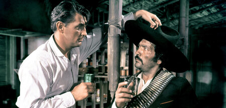Abenteurer (Robert Mitchum, l.) verhandelt mit mexikanischem Rev...