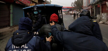 2021-02-04T070720Z_122983652_RC2JLL9A0CRG_RTRMADP_3_NEPAL-POLITI