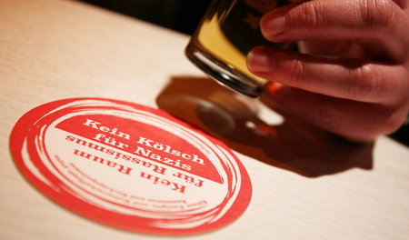Ein Bierdeckel der Kölner Initiative im Einsatz